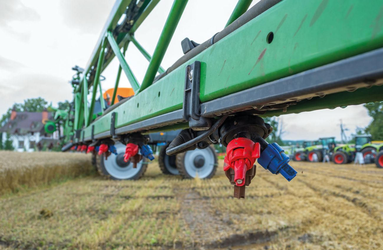 a modern sprayer bar with various nozzles for different conditions of application of chemistry. High ground clearance