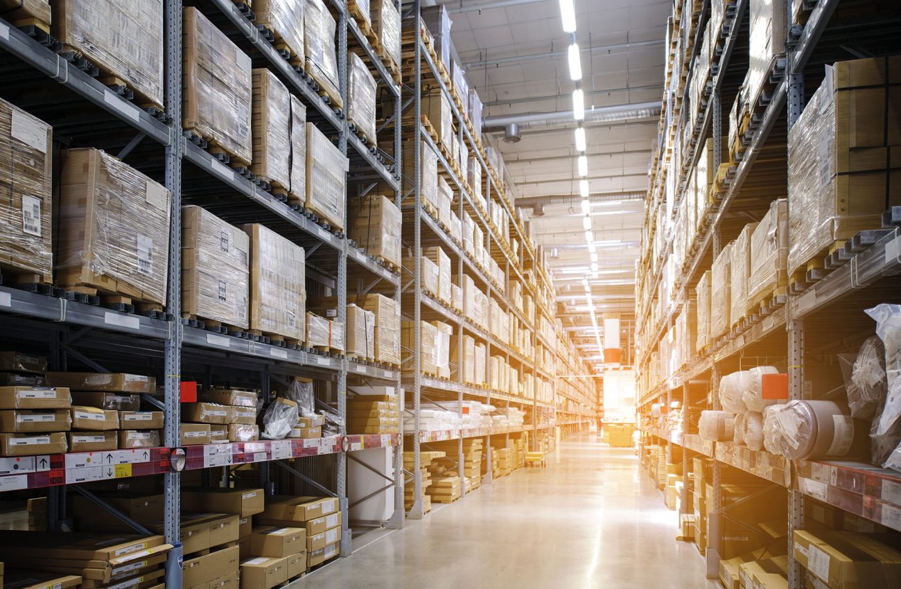 Rows of shelves with boxes in modern warehouse